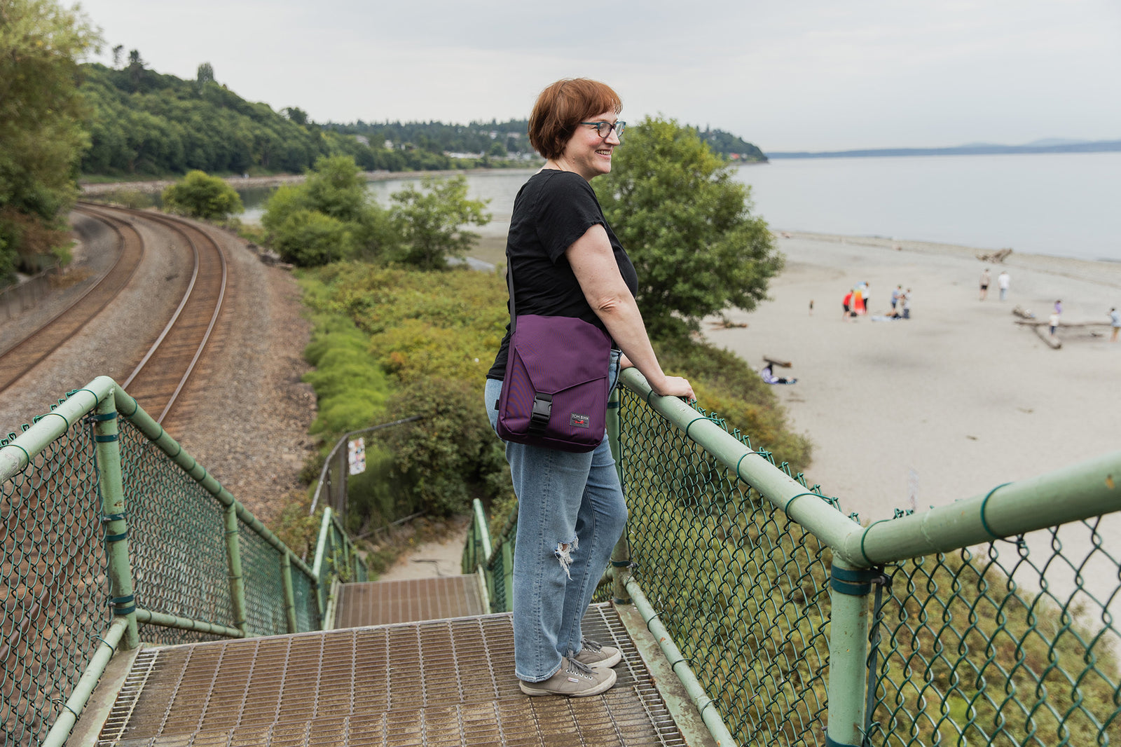 visible lifestyle^^A person wearing a Medium Cafe Bag at a beach
