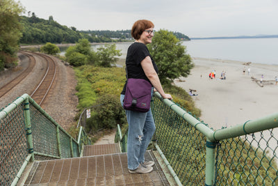 visible lifestyle^^A person wearing a Medium Cafe Bag at a beach
