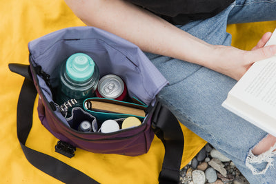 visible lifestyle^^A Medium Cafe Bag with drinks, a notepad, and other miscellaneous items in it.