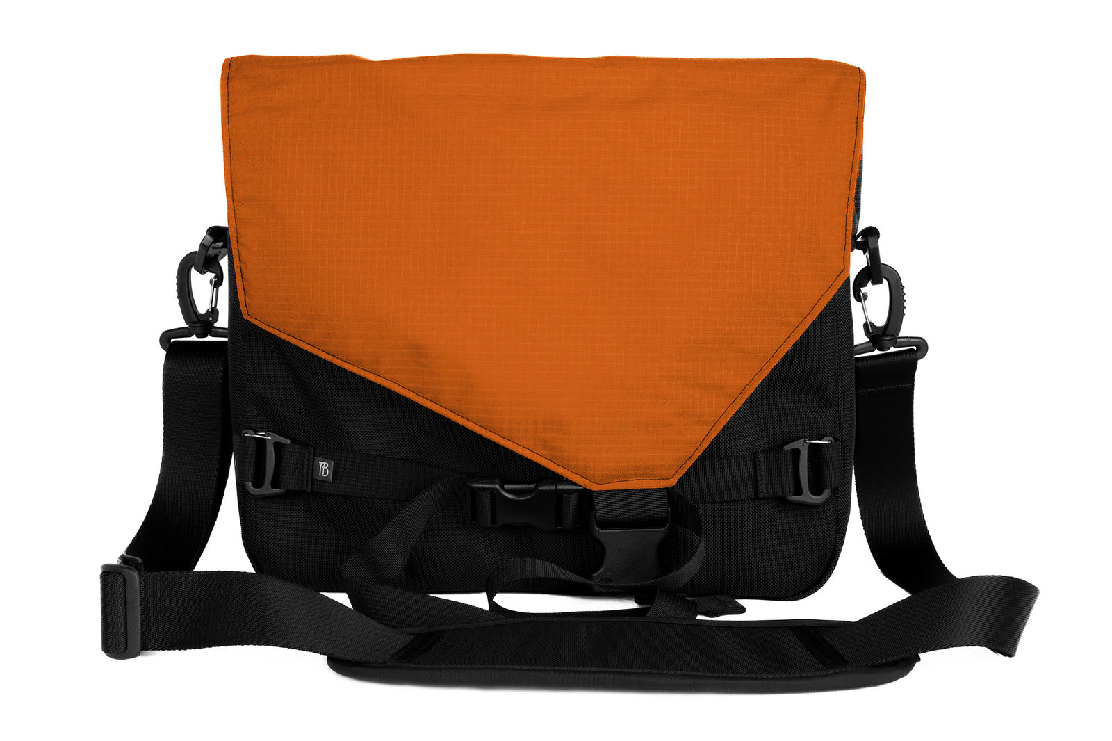 visible variant TB0204-BKPL^^The Maker's Bag in Black with Persimmon interior.
