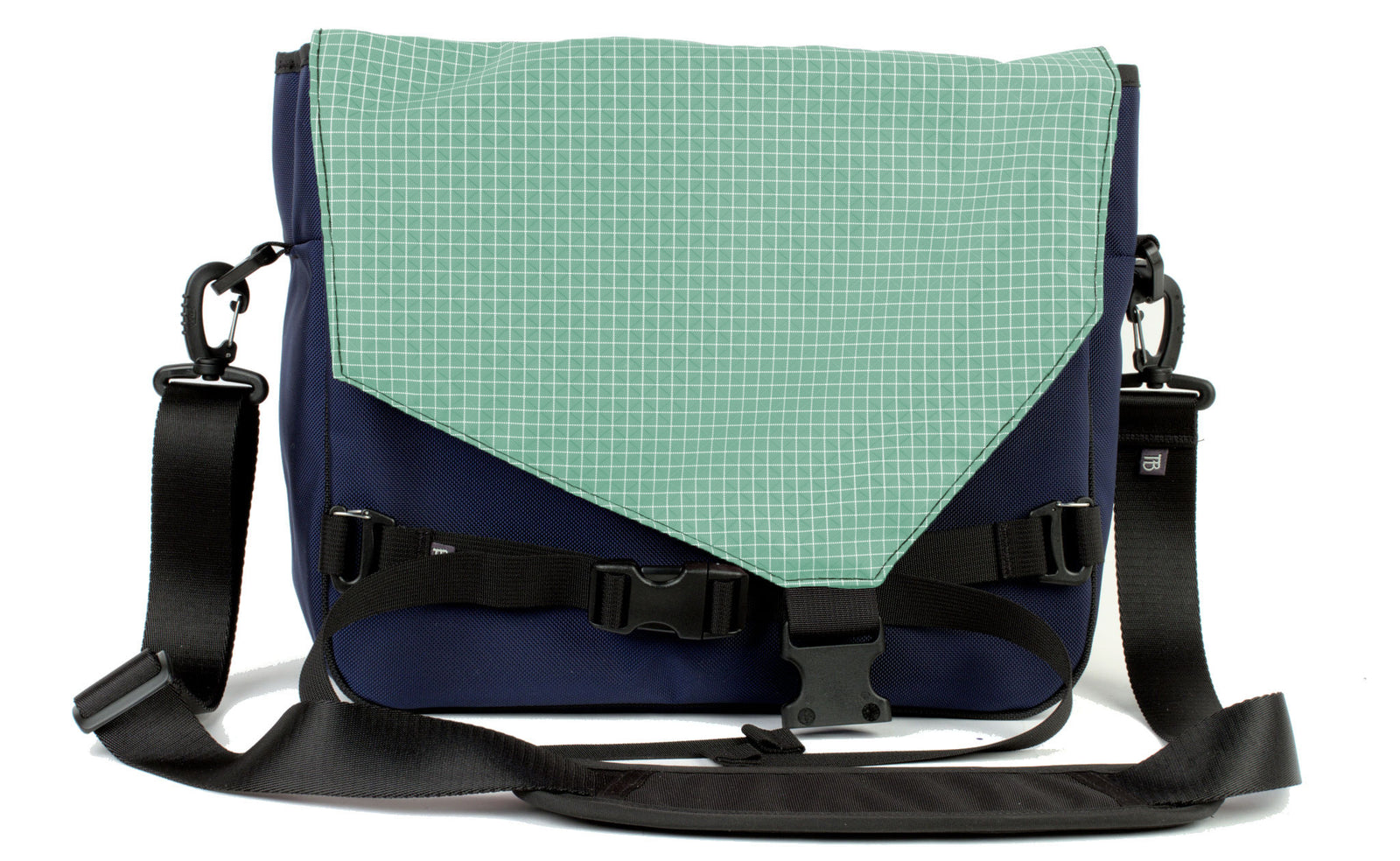 visible variant TB0204-DKGD^^The Maker's Bag in Deep Blue (dark blue) 525 Ballistic with a Seafoam (faded green with white grid) Halcyon interior.