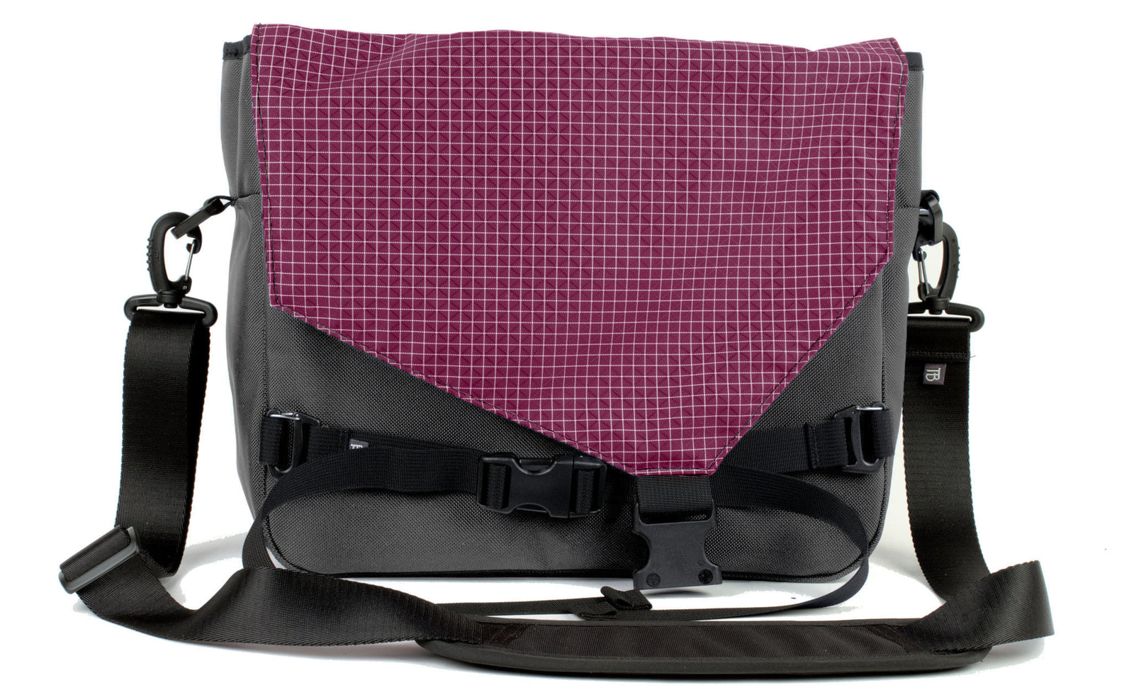 visible variant TB0204-GK5D^^The Maker's Bag in Nebulous Grey (Medium grey) Ballistic with a Acai (dark purple with white grid) 200 Halcyon interior.
