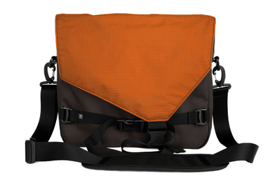 visible variant TB0204-RKPL^^The Maker's Bag in Ursa (brown-grey) Ballistic with a Persimmon (dark orange with orange grid) 210 Cerylon interior.