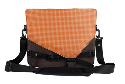 visible variant TB0204-RKZD^^The Maker's Bag in Ursa (brown-grey) Ballistic with a Zest (orange with white grid) 200 Halcyon interior.