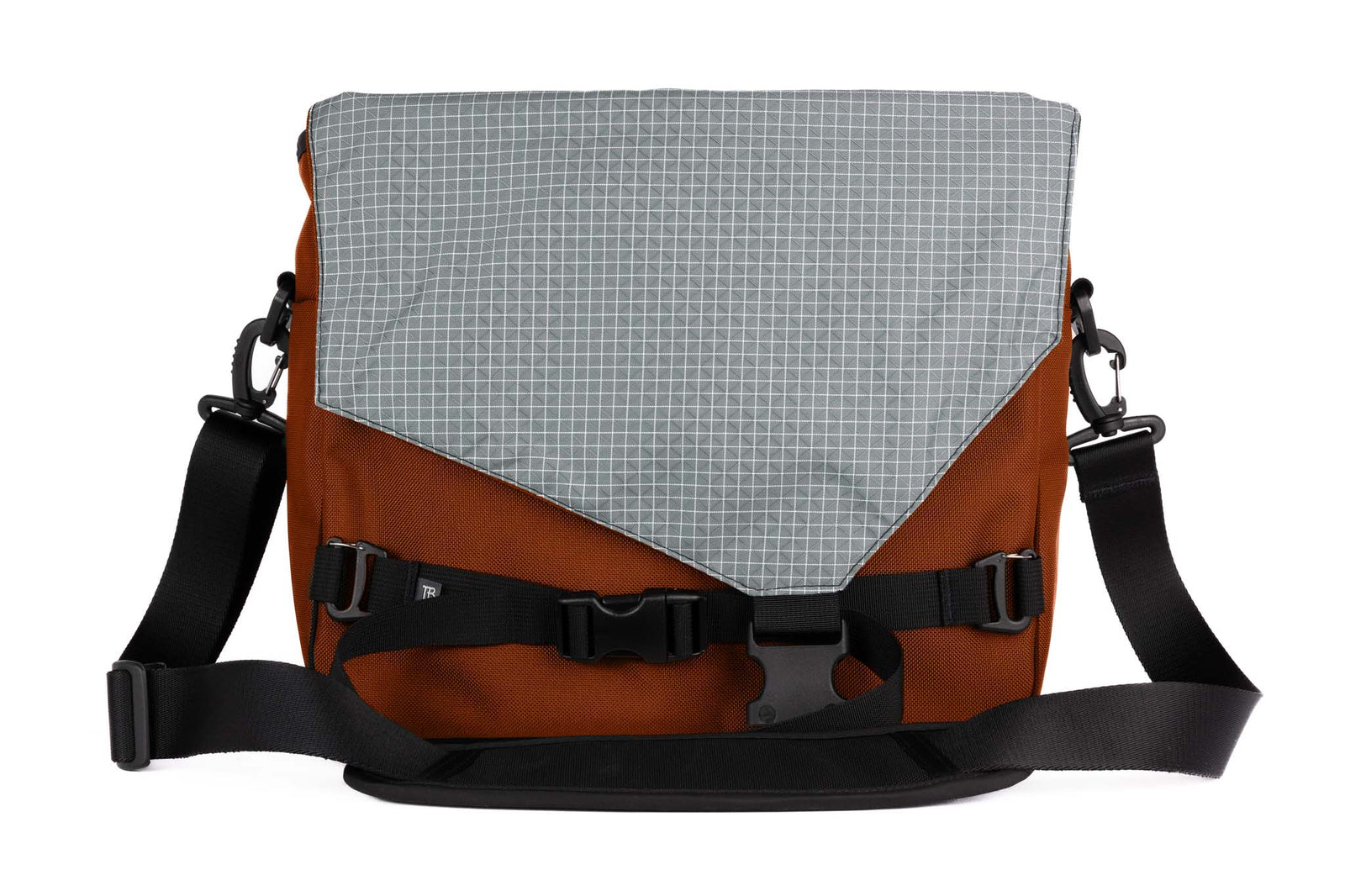 visible variant TB0204-TKND^^The Maker's Bag in Burnt Orange 525 Ballistic with a Northwest Sky (light grey with white grid) 200 Halcyon interior.