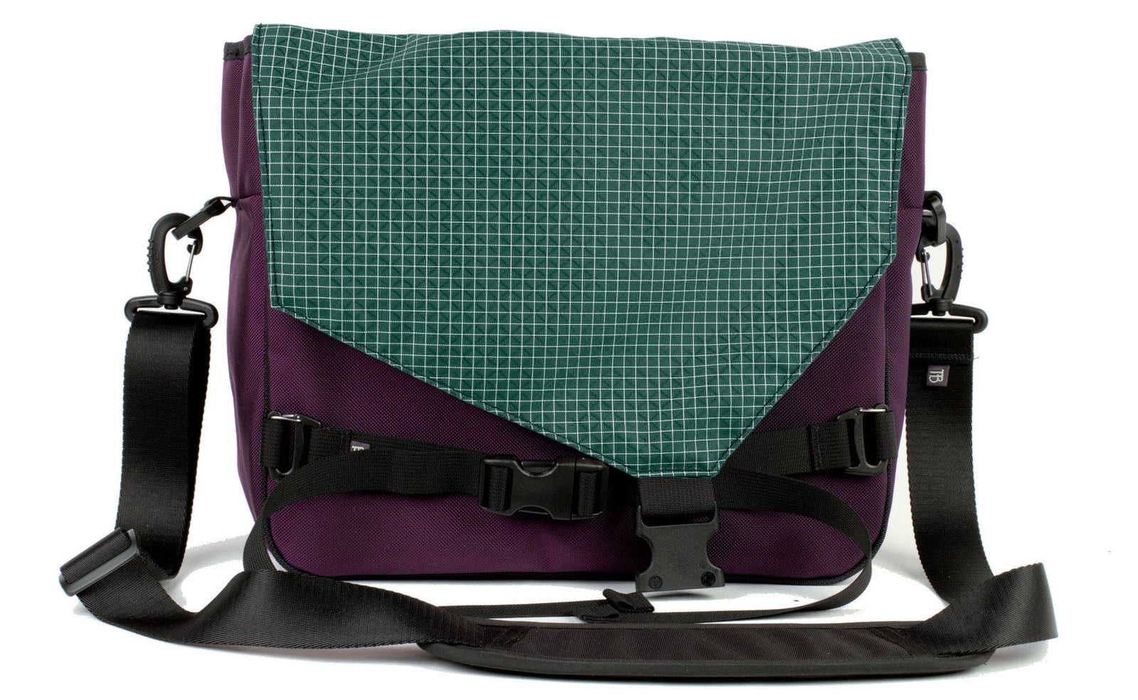 visible variant TB0204-UKKD^^The Maker's Bag in Aubergine (dark purple) Ballistic with a Sitka (dark green with white grid) 200 Halcyon interior.