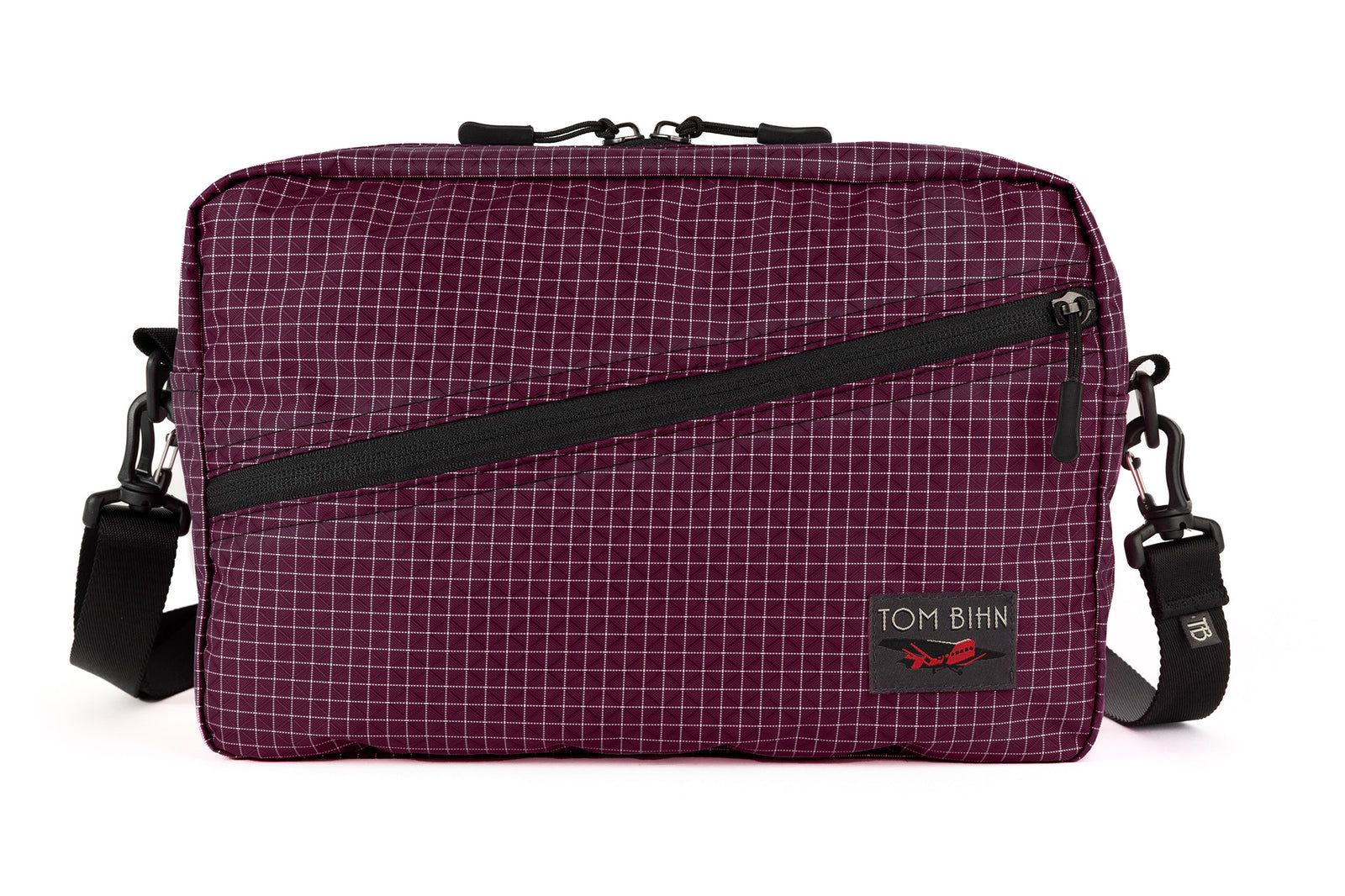 visible variant TB0921-5D^^A Packing Cube Shoulder Bag in Acai (dark purple with white grid) 200 Halcyon with a shoulder strap attached