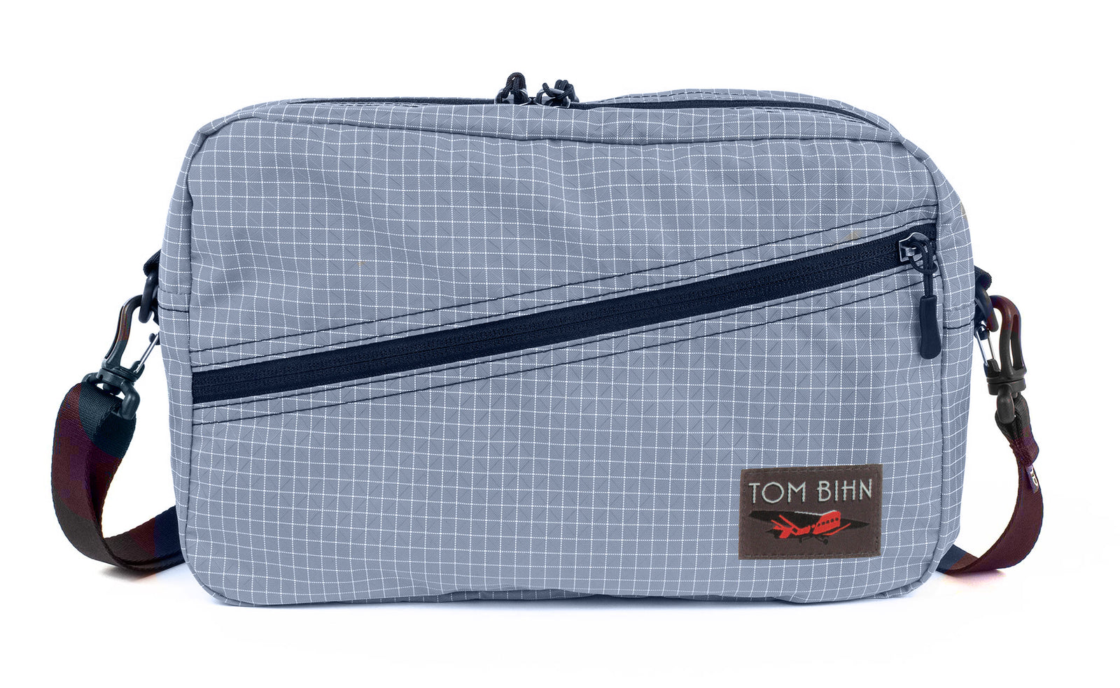 visible variant TB0921-ND^^A Packing Cube Shoulder Bag in Northwest Sky (light grey with white grid) 200 Halcyon with a 1-inch shoulder strap attached.