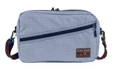 visible variant TB0921-ND^^A Packing Cube Shoulder Bag in Northwest Sky (light grey with white grid) 200 Halcyon with a 1-inch shoulder strap attached.
