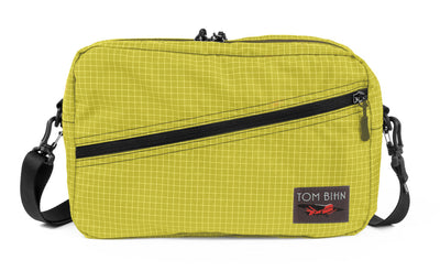 visible variant TB0921-WD^^A Packing Cube Shoulder Bag in Wasabi (green with white grid) 200 Halcyon with a shoulder strap.