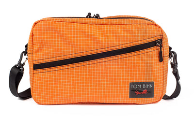 visible variant TB0921-ZD^^A Packing Cube Shoulder Bag in Zest (pale orange with white grid) 200 Halcyon with a 1-inch shoulder strap attached