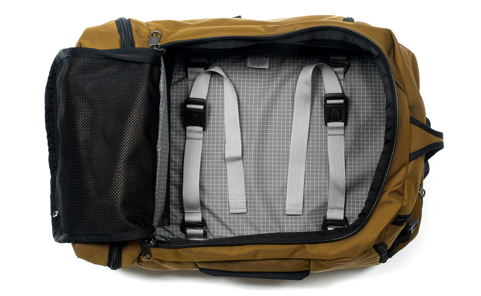 visible variant TB0902-CKND^^ A Techonaut 30 with a Coyote (sand brown) exterior with Northwest Sky (light grey with white grid pattern) 200 Halcyon interior.