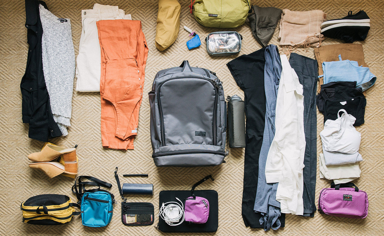 visible detail^^ A second potential load out of the Aeronaut 45, including clothes, toiletries, shoes, a water bottle, and a tablet.