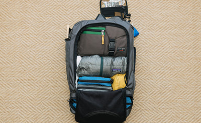 A potential load out of the Techonaut 45, including a LGD Waist Pack, packing cubes, a puffy jacket, and stuff sacks.