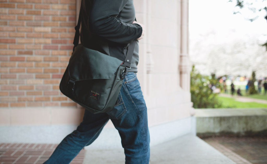 lifestyle visible^^A person carrying a relatively full Maker's Bag.
