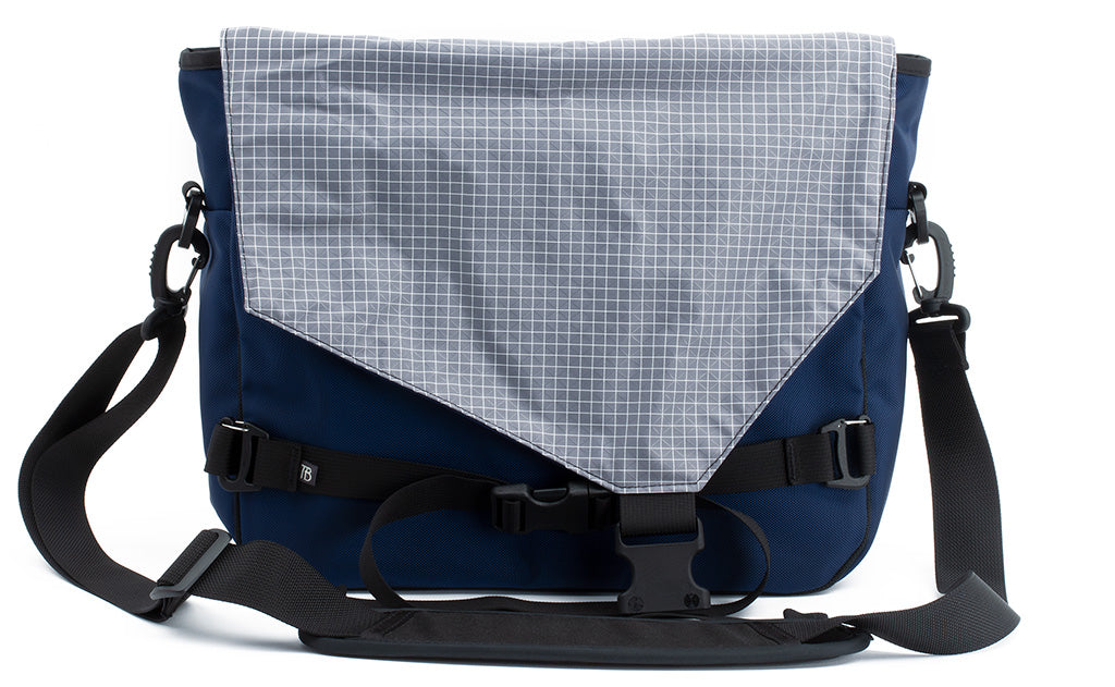 visible variant TB0204-DKND^^The Maker's Bag in Deep Blue (dark blue) 525 Ballistic with a Northwest Sky (light grey with white grid) 200 Halcyon interior.