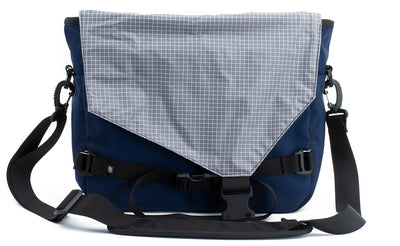 visible variant TB0204-DKND^^The Maker's Bag in Deep Blue (dark blue) 525 Ballistic with a Northwest Sky (light grey with white grid) 200 Halcyon interior.
