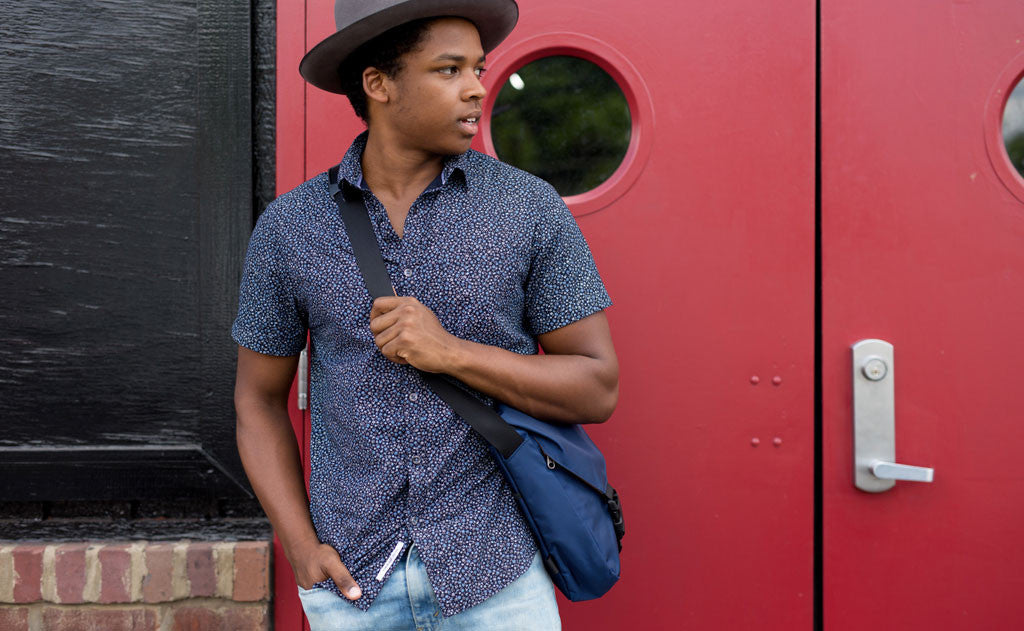 ^A person wearing the Medium Cafe Bag as a crossbody.