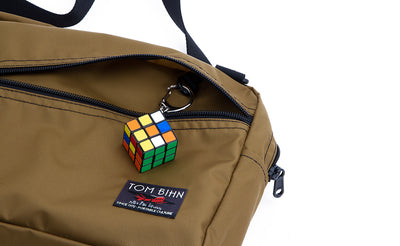 ^^A Packing Cube Shoulder Bag with a kechain attached to the front pocket's interior o-ring.