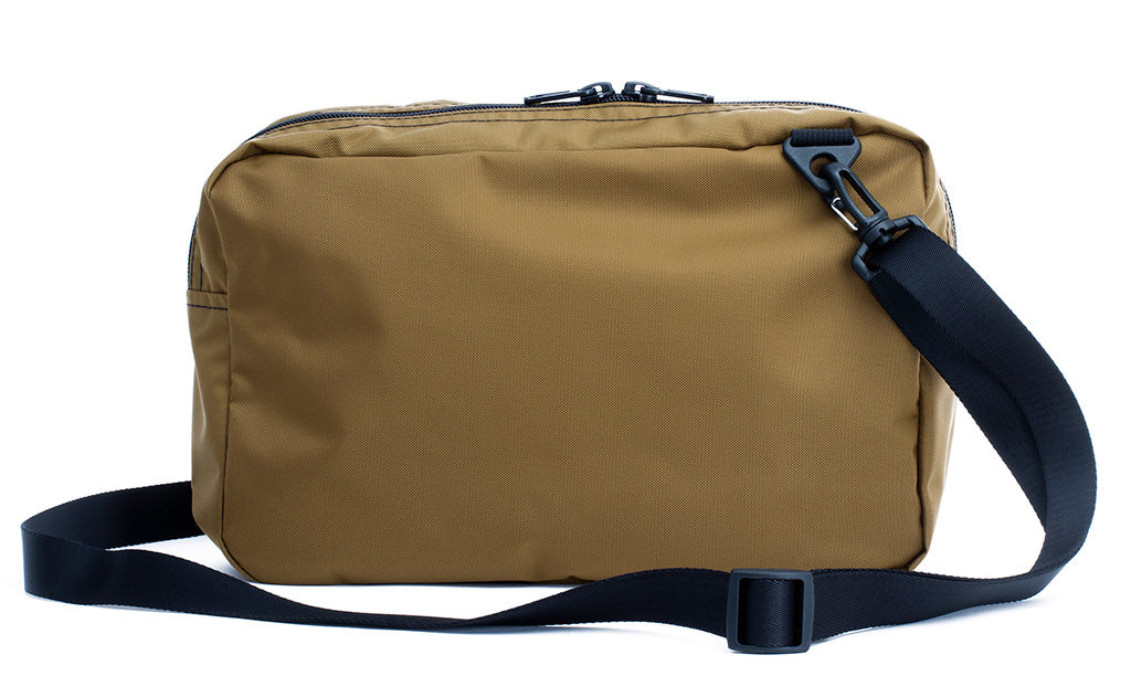 ^^A reverse shot of the Packing Cube Shoulder Bag with a 1" shoulder strap attached.