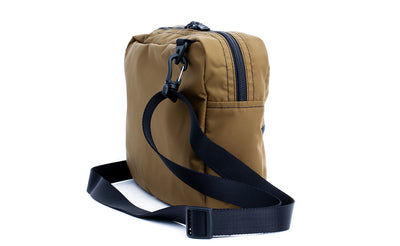 ^^A reverse 3/4 shot of the Packing Cube Shoulder Bag with a 1" shoulder strap attached.