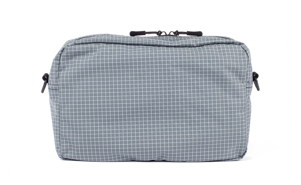 detail visible^^A reverse shot of the Packing Cube Shoulder Bag.