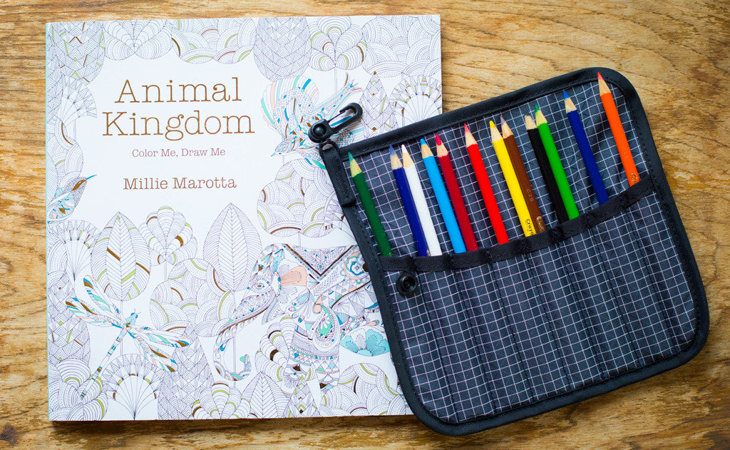 lifestyle visible^^A Tool Pen Wrap filled with colored pencils.