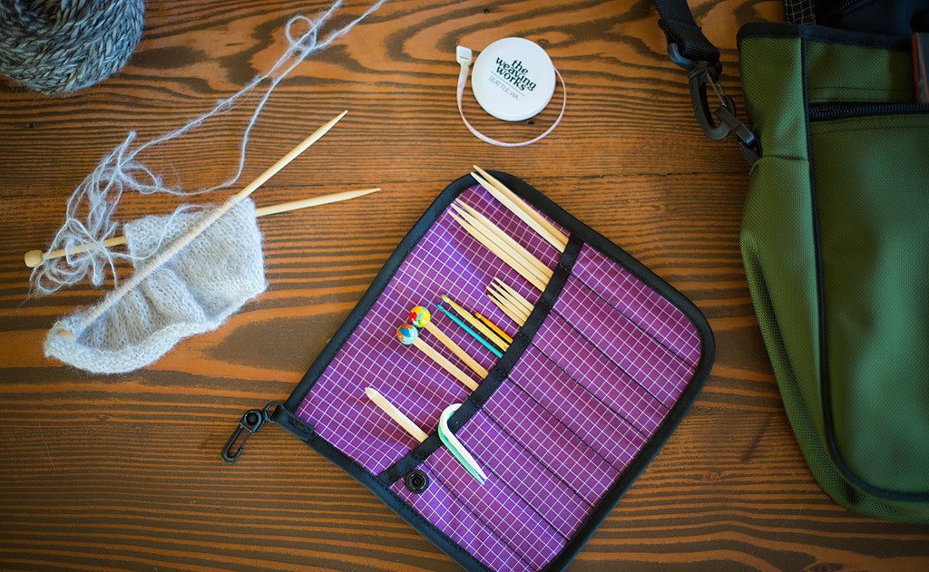 lifestyle visible^^A Pen Tool Wrap filled with knitting tools.