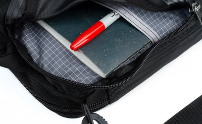 detail visible^^The side compartment of the Pilot with a notepad and marker inserted into the interior pocket.