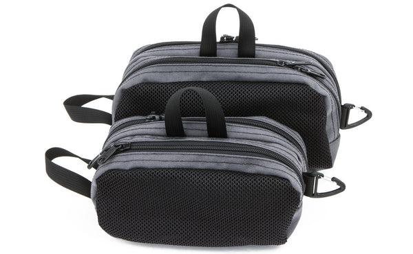 A Small Snake Charmer in front of a Large Snake Charmer.