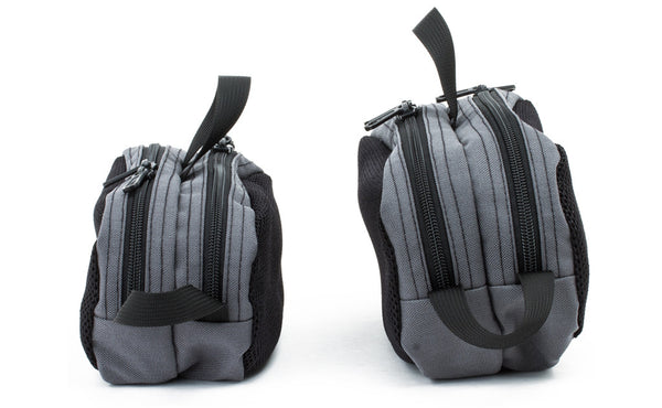 A Small Snake Charmer next to a Large Snake Charmer.