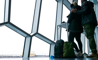 People at an airport with a Synapse 25.