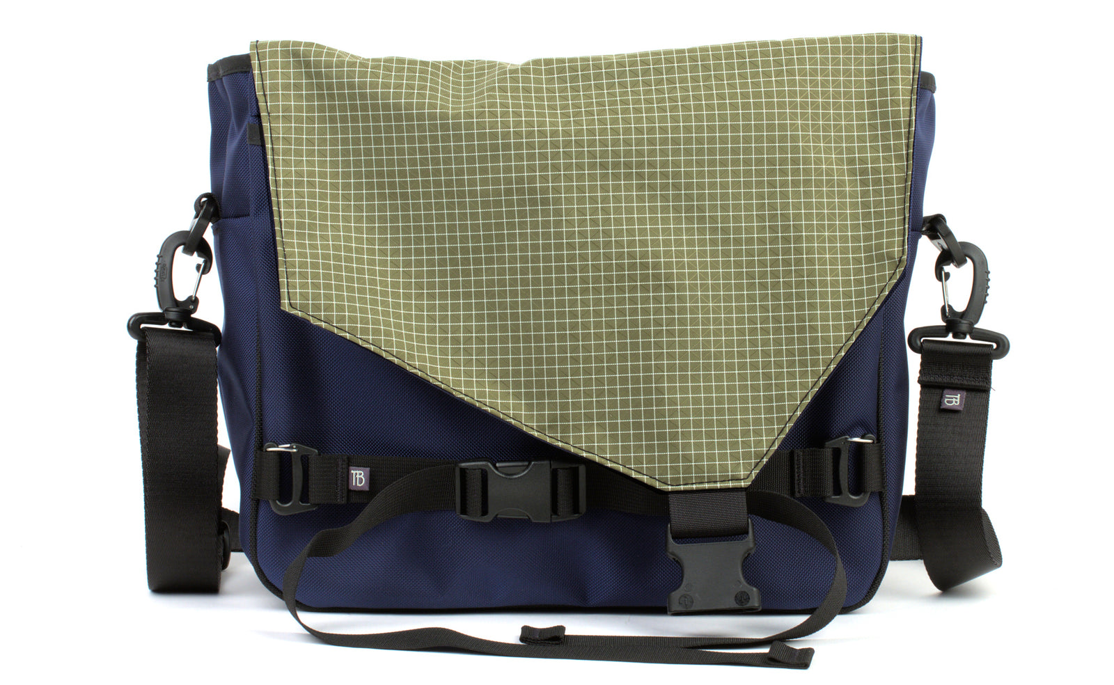visible variant TB0204-DK8D^^The Maker's Bag in Deep Blue (dark blue) 525 Ballistic with Taiga (olive green with white grid) 200 Halcyon interior.