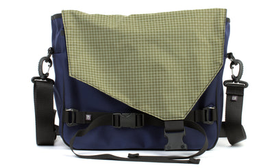 visible variant TB0204-DK8D^^The Maker's Bag in Deep Blue (dark blue) 525 Ballistic with Taiga (olive green with white grid) 200 Halcyon interior.