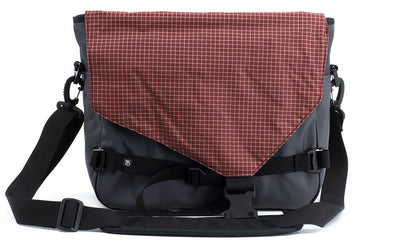 visible variant TB0204-GK6D^^The Maker's Bag in Nebulous Grey (Medium grey) Ballistic with a Moab (brick red with white grid) 200 Halcyon interior.