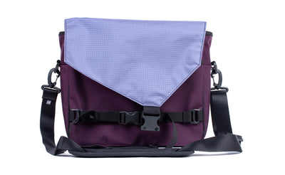 visible variant TB0204-UKDL^^The Maker's Bag in Aubergine (dark purple) Ballistic with Dusk (blue-grey) Cerylon interior.