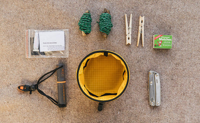 visible detail ^^A Small Travel Tray with a possible loadout (including a few bolts of bungee cord, a couple clothespins, a box of matches, a knife, a portable flashlight, and a bag patch kit).