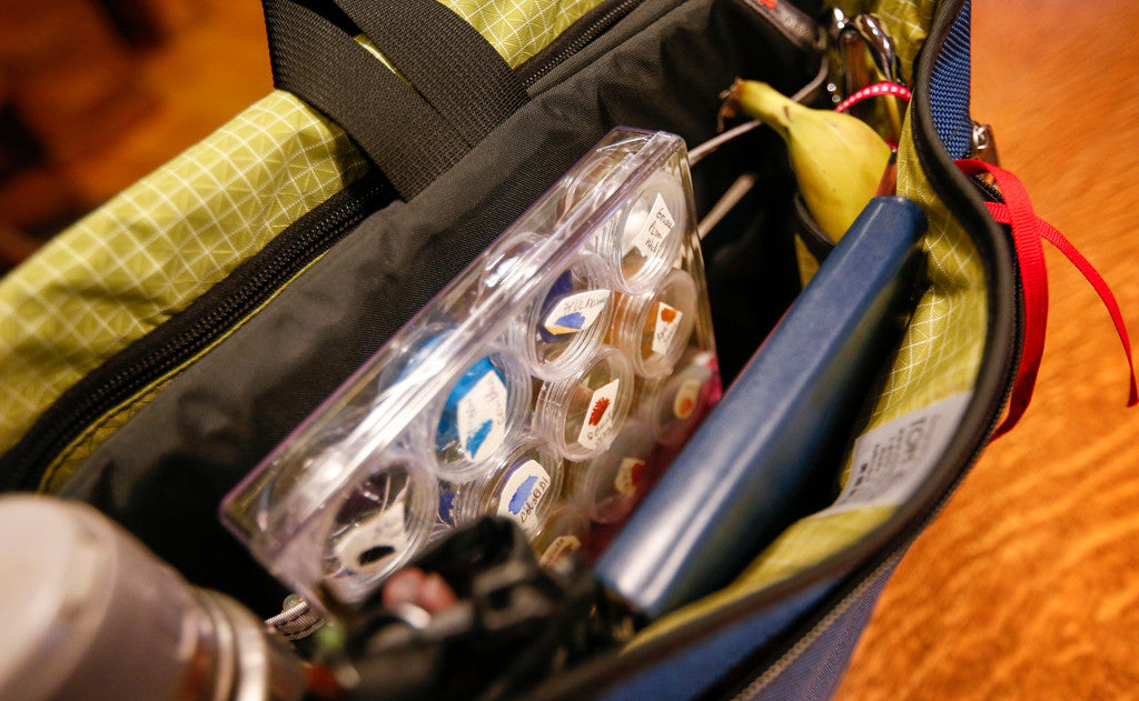 A Maker's Bag holding art supplies including a water color pallet.