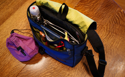^^A full Maker's Bag free-standing on the ground with a Yarn Stuff Sack next to it.