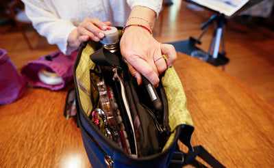 ^^A person removing a tablet from their Maker's Bag.