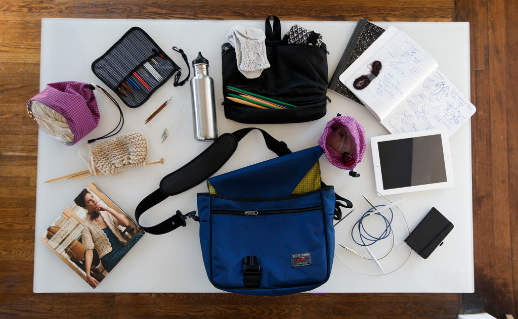 ^^A Maker's Bag surrounded by knitting and accessories.