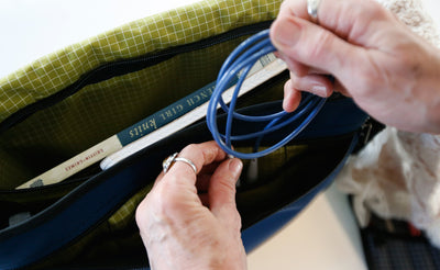 ^^A person pulling a cable from thier Maker's Bag.
