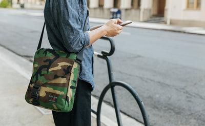 Person wearing the Medium Cafe Bag in Beaver Camo.