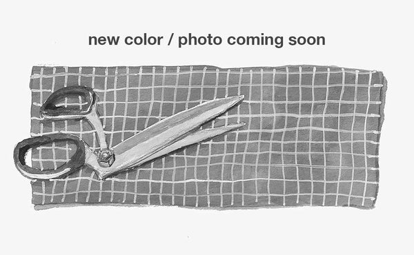 Text: new color / photo coming soon; Image: An illustration of a pair of shears on a swatch of fabric.