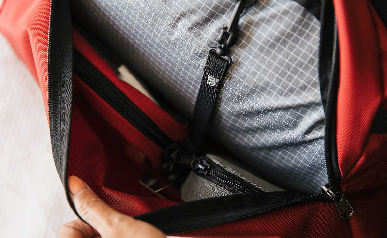 detail visible^^A view inside the all-fabric 3D pocket of the OSCA; the included 8" Key Strap in Black is shown.