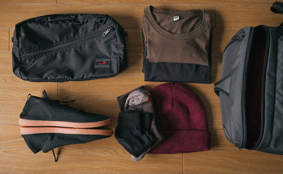 ^^A Packing Cube Shoulder Bag with an example loadout (shirts, socks, a toque, and thin shoes).