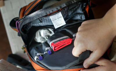 lifestyle visible^^A person removing a Synapse 19 Freudian Slip form the main compartment of the Synapse 19.