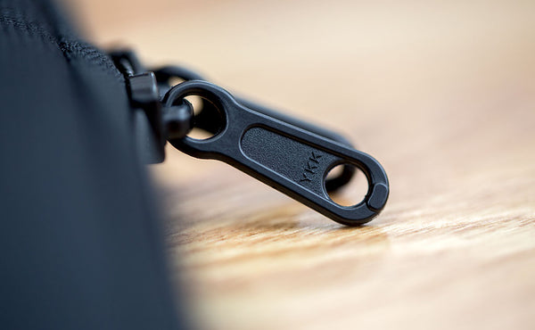 A close shot of the zipper pull tabs.