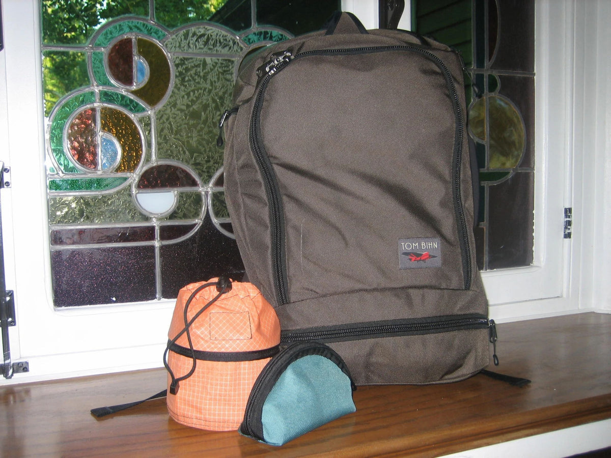 A Techonaut 30, Small Travel Tray, and Q-Kit sitting together on a windowsill