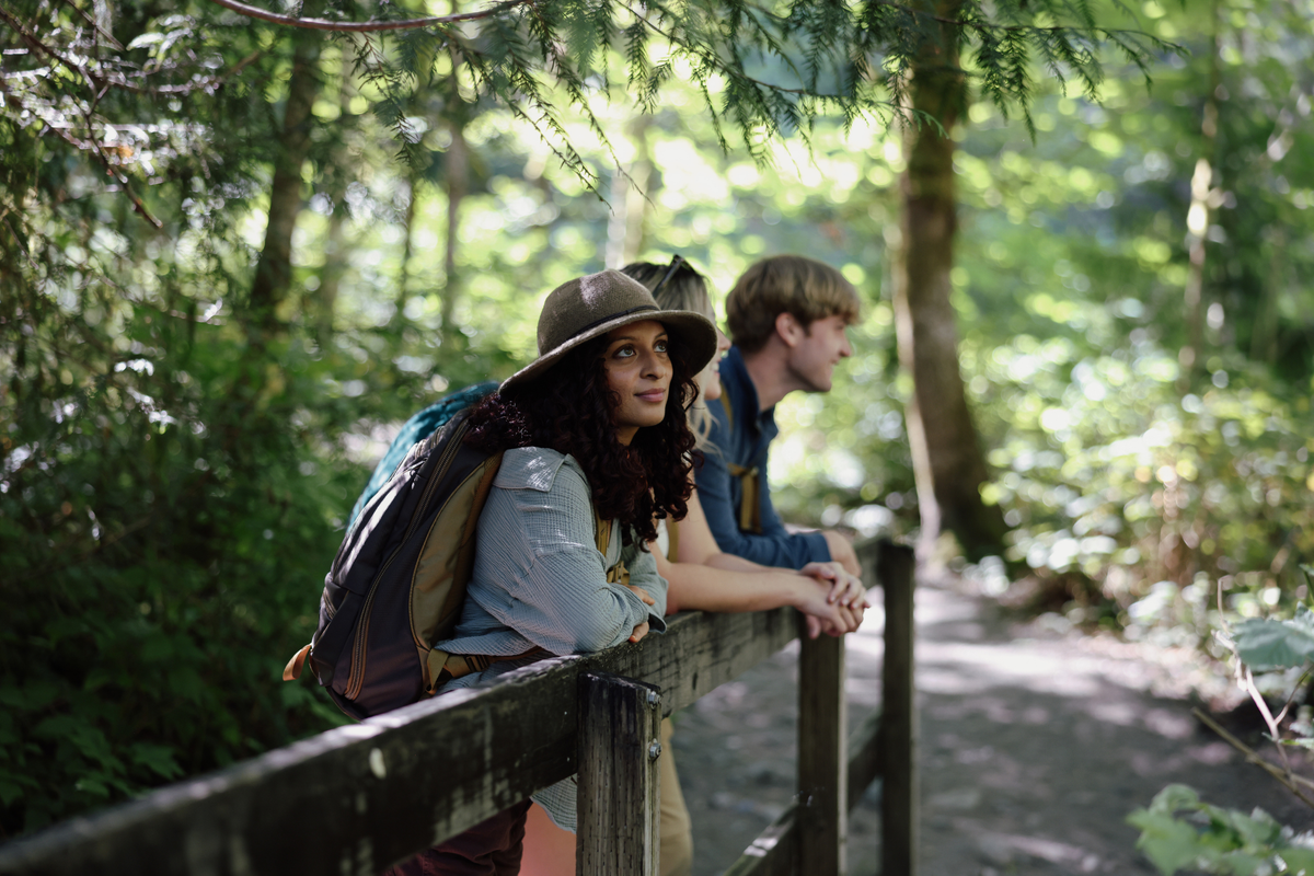 Three hikers wearing the Guide's Edition Synik 26